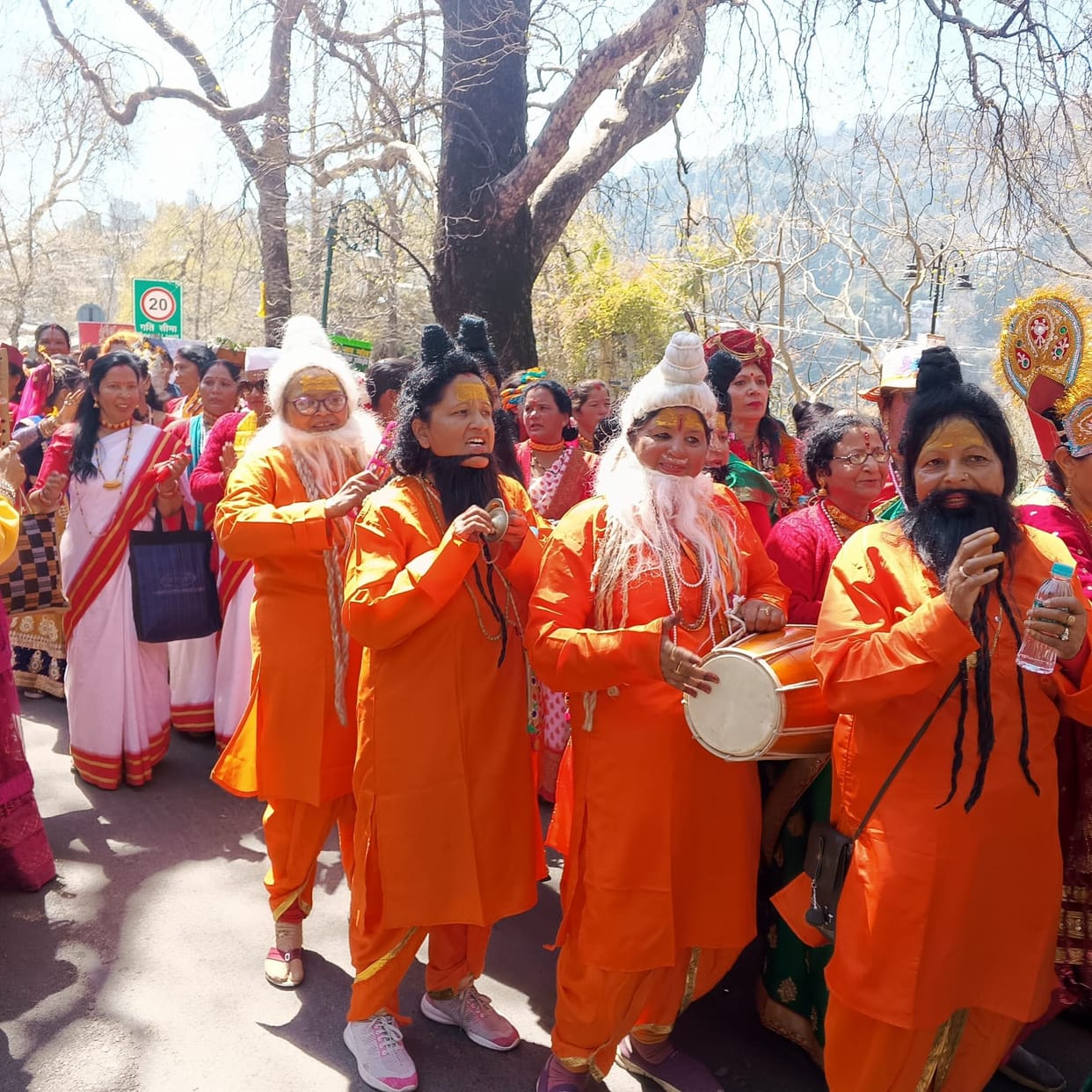 Women created mime in Holi procession