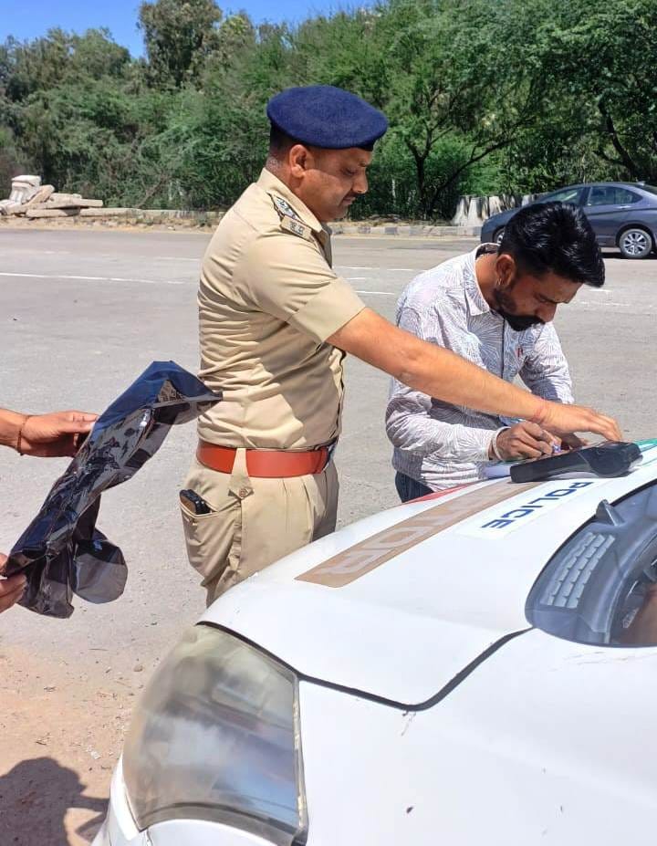 Challan issued for 10 vehicles with black film on glass
