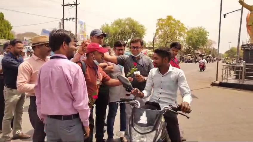 Initiative of government doctors, giving rose flowers and appealing to wear helmet and seat belt