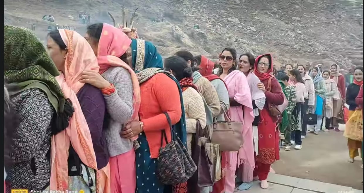 Faith... Devotees stood in queues amidst snow mountains to have darshan of the Mother Goddess.