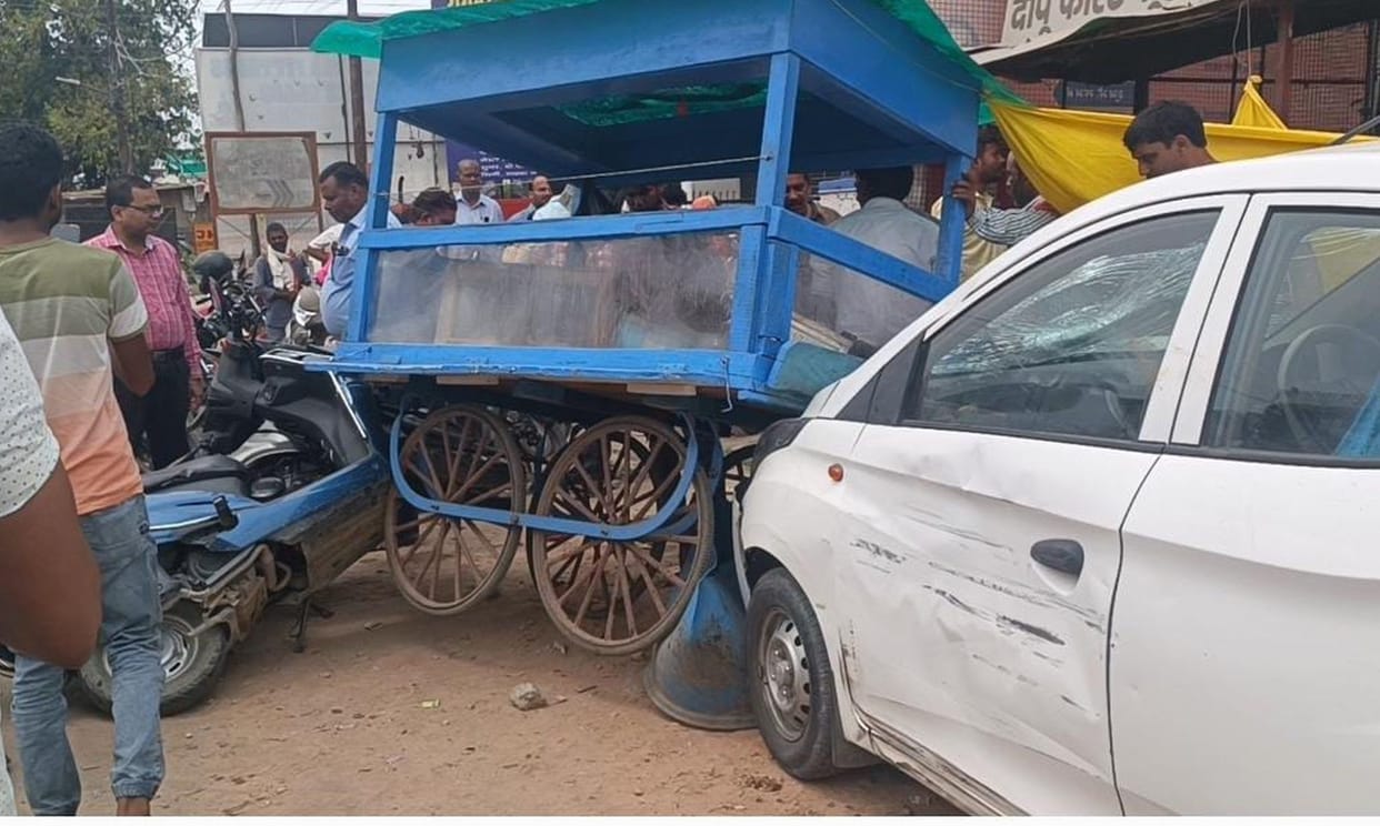 Car hits vehicles and enters shop, two injured