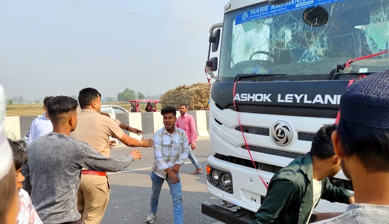 Bike rider dies in collision with truck, second seriously