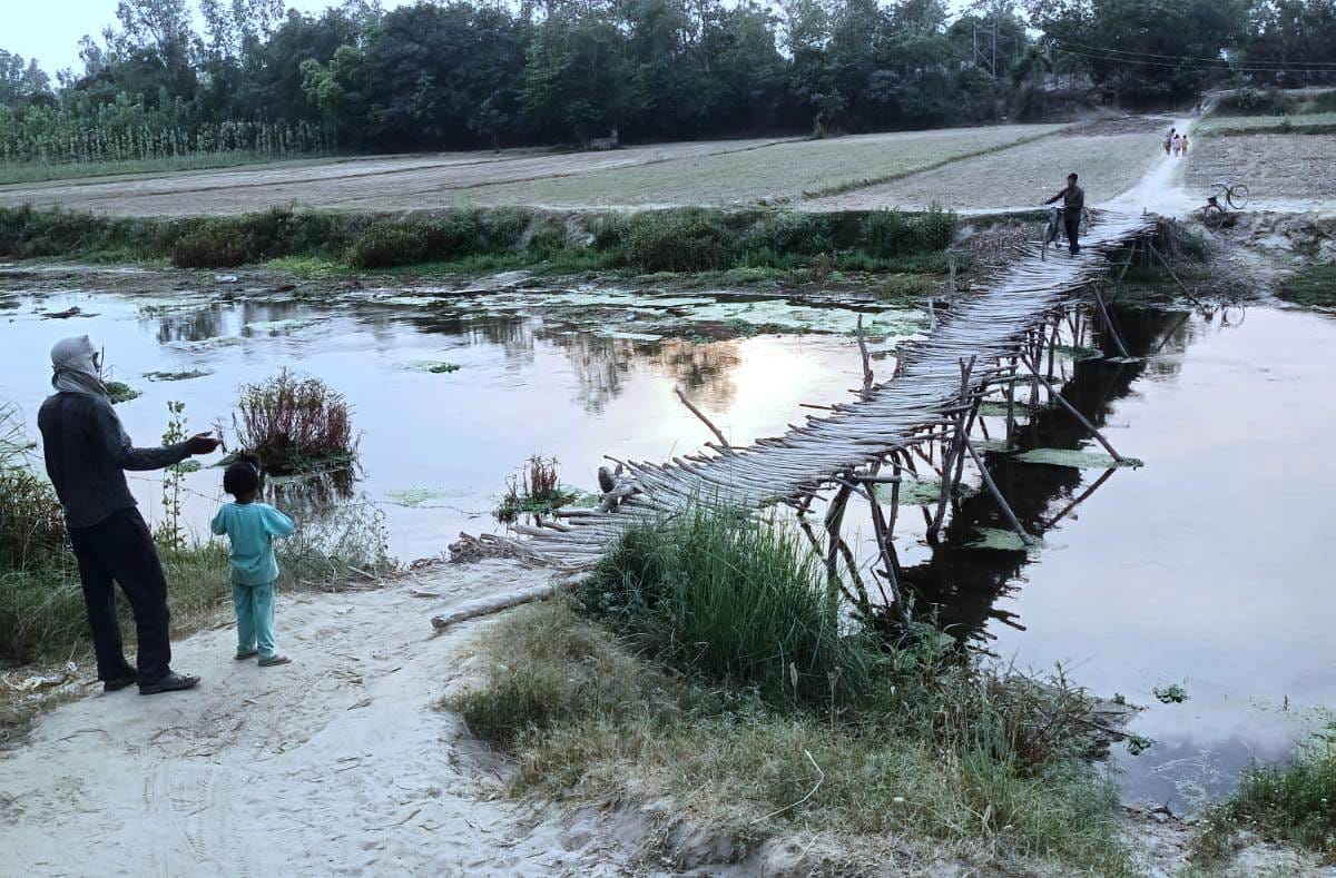 Wooden bridge supporting crossing Kailash