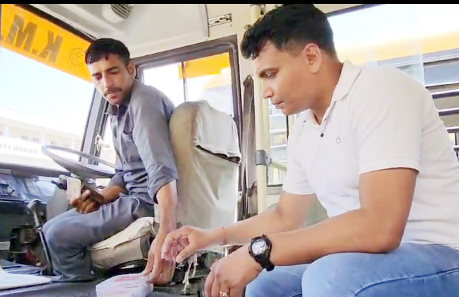 RTA department personnel checking buses in KM school.