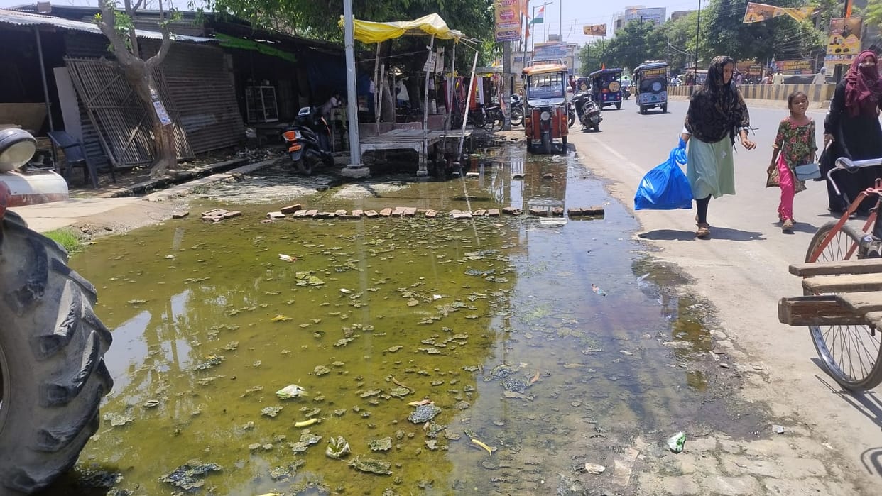 Road left after digging for drain construction, people troubled by flying dust
