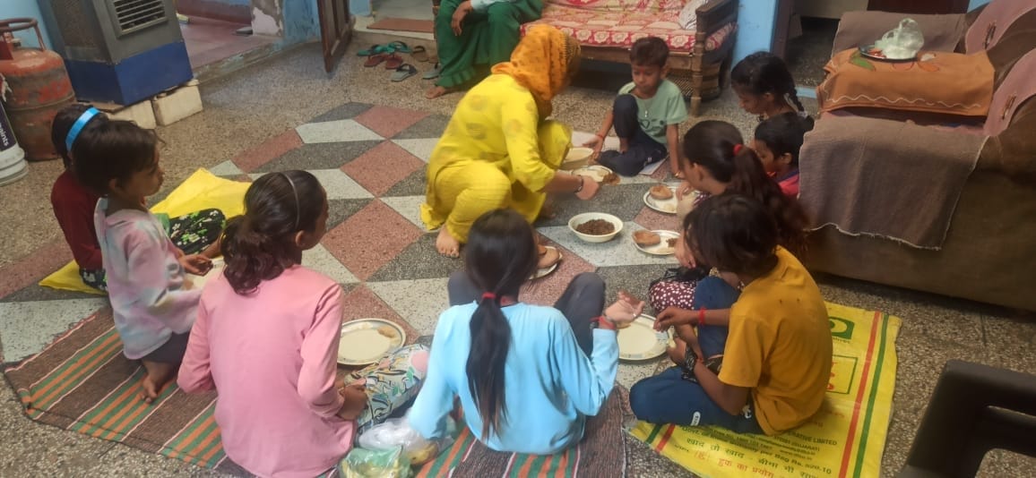 Girls dressed in chunri, tilak, worship and opened the fast