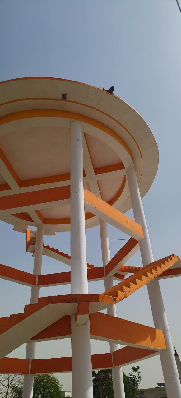 Woman climbs on water tank, gets pulled down by police after 3 hours