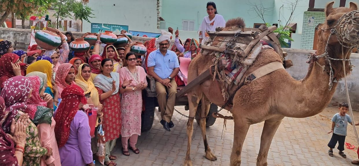 SDM wearing turban and sitting in a camel cart appealed for voting