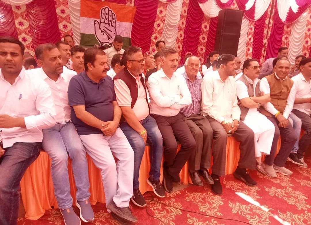 Congress ticket holders gathered on a stage in Garli