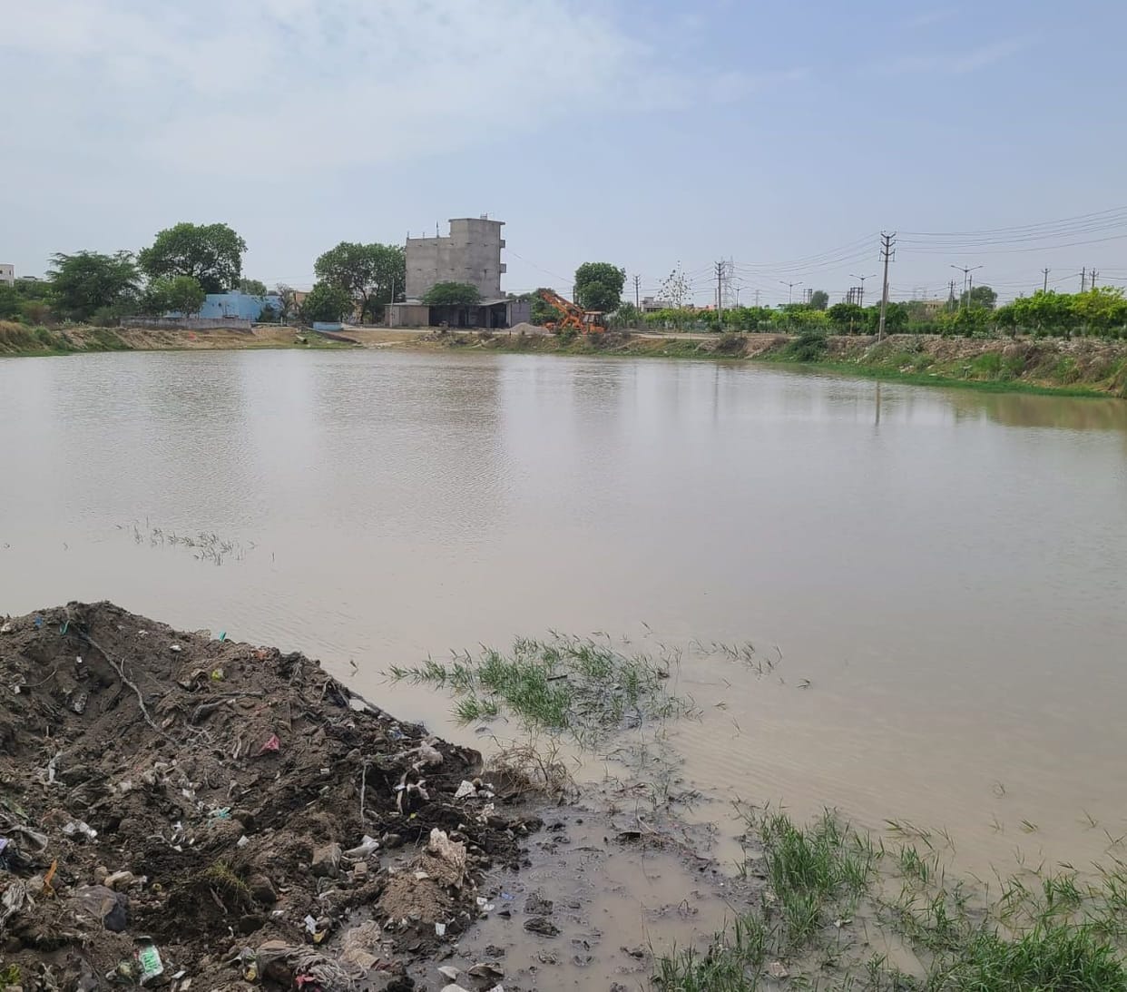 When people protested against dumping garbage in the pond, the officials got it cleaned.