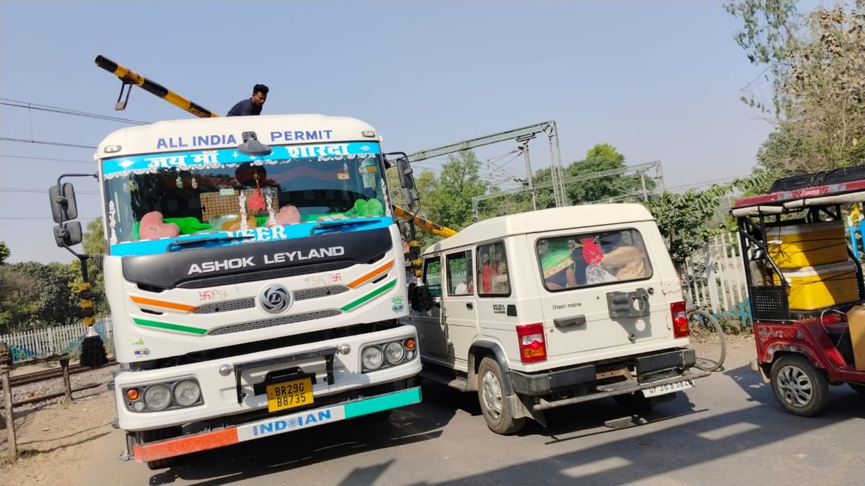 Truck hits rail gate