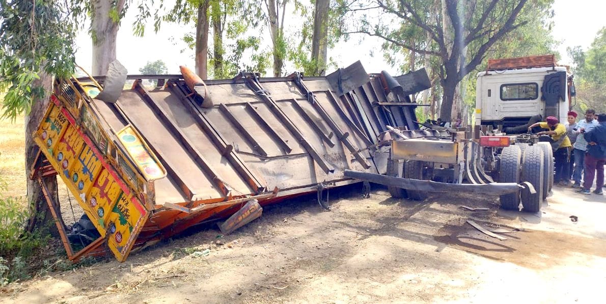 Truck full of wheat sacks overturned