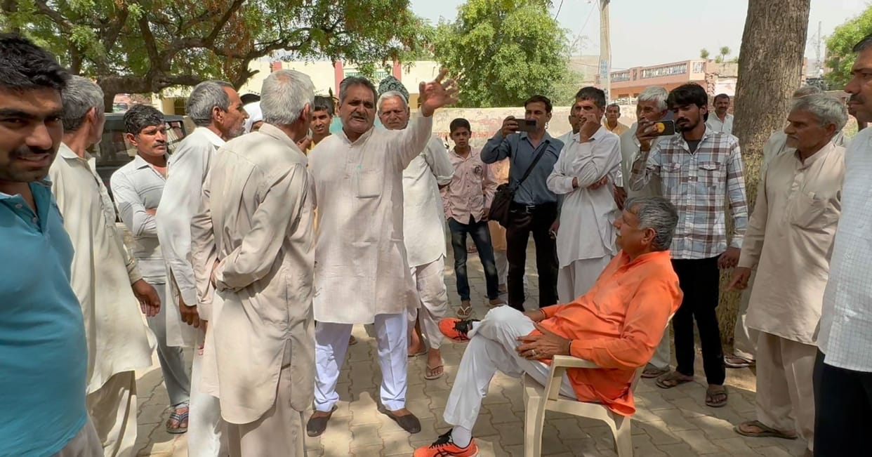 Villager presenting his views in front of BJP candidate Dharambir Singh in village Ghikada.