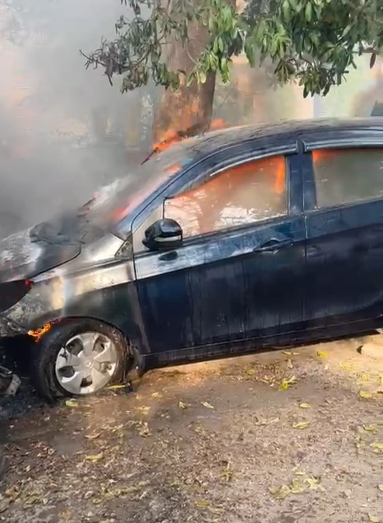 Fire broke out in a car parked outside the house