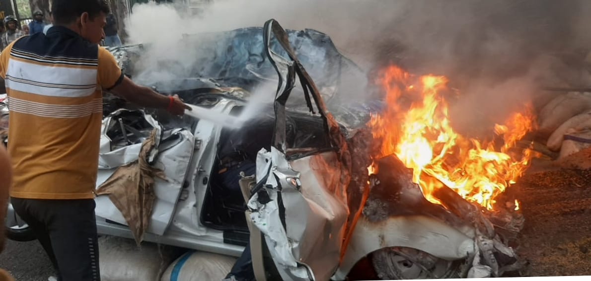 Truck loaded with rice overturns on car, one dead