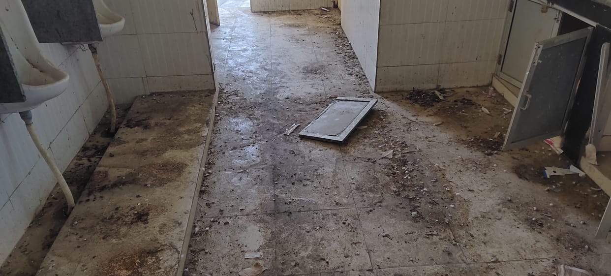 Sports stadium toilet is in poor condition