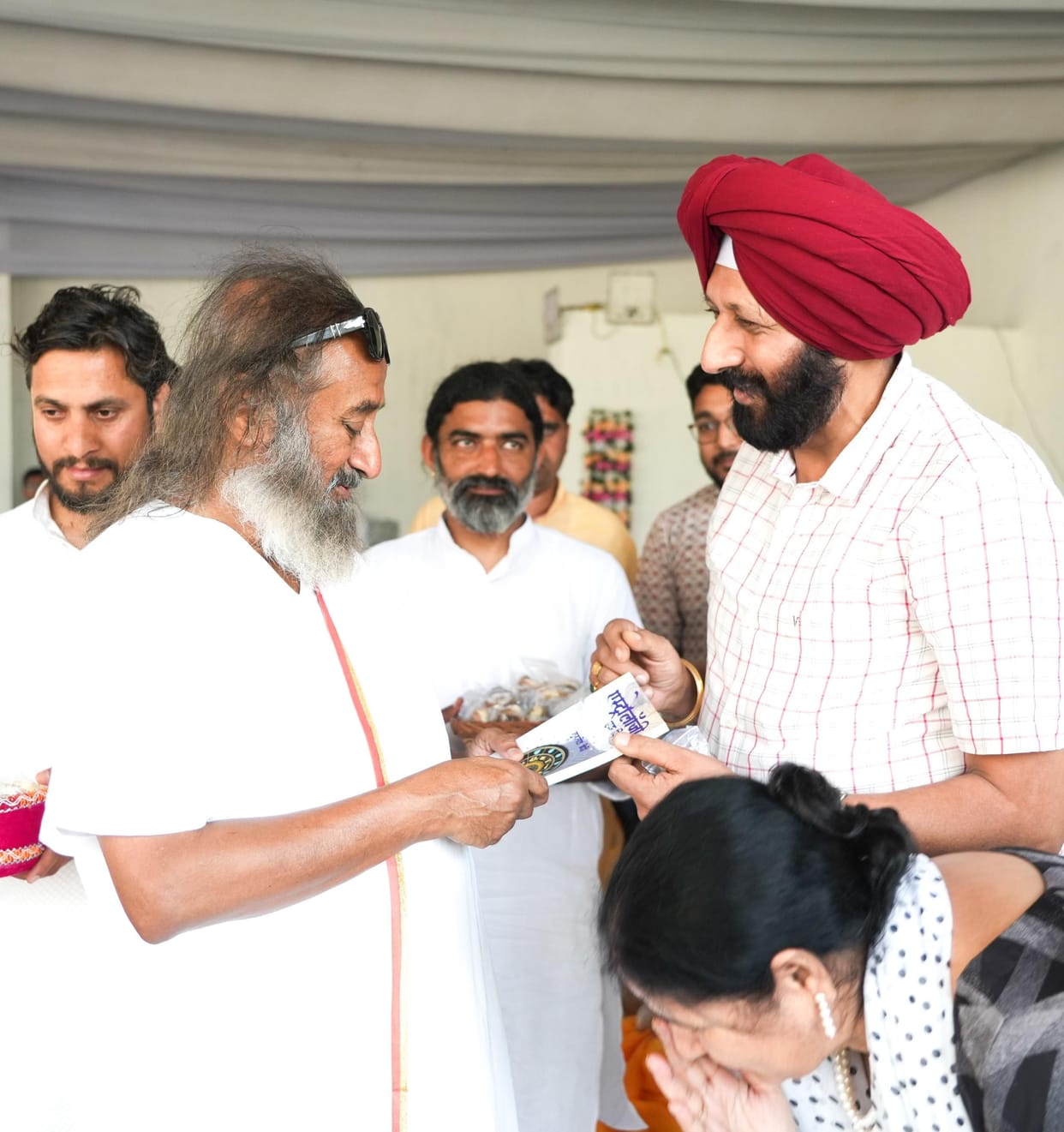 Gift of research book written on astrology to Sri Sri Ravi Shankar