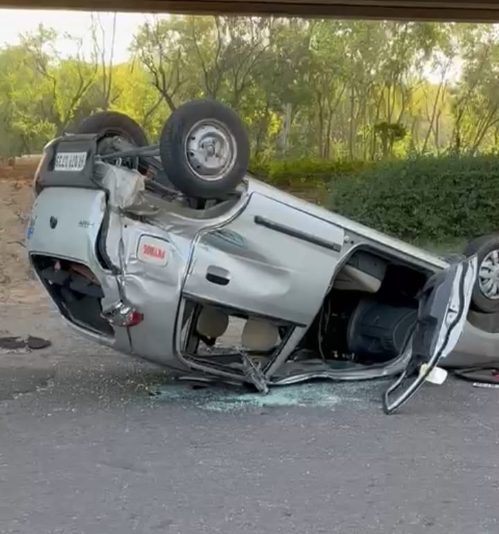 Car overturns after collision with bus, couple injured