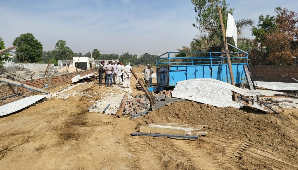 Allegation of breaking the boundary wall and gate by sending bulldozer