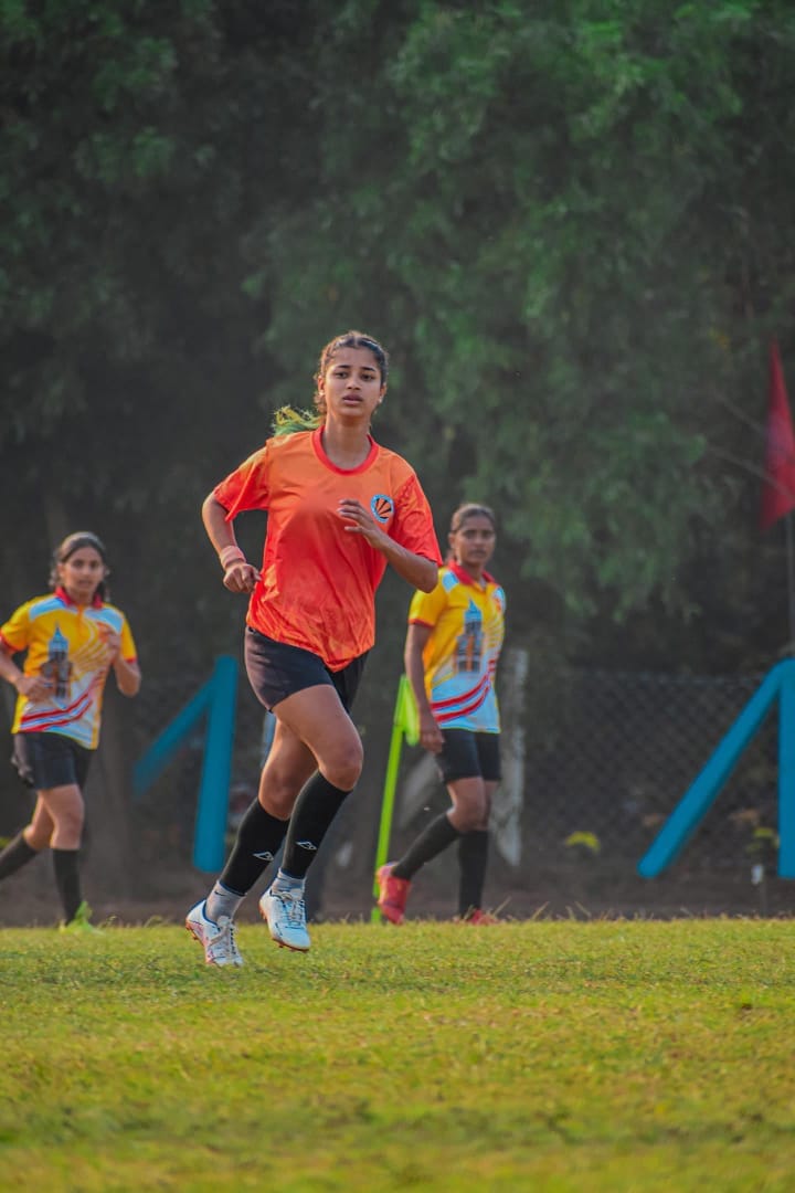 woman football 2 players practicing hard
