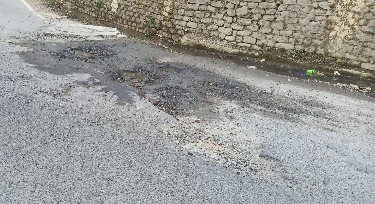 Gravel poured to fill potholes of Chamba-Bharmour NH washed away in rain