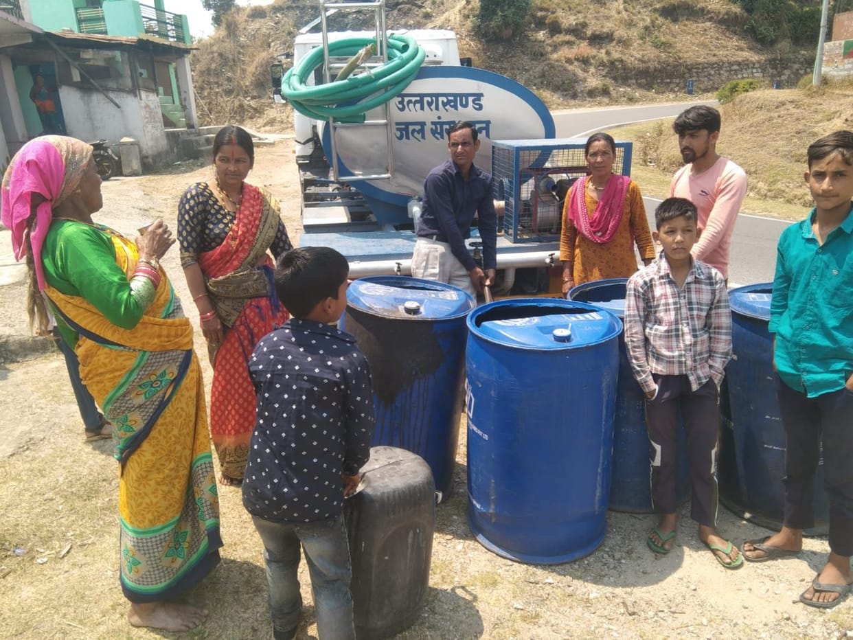 Children and women are racing to fill water from tanker