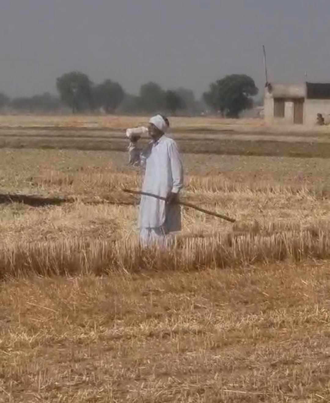 Elderly man openly swallows pesticide in protest against watering the disputed two and a half acre land of a cowshed