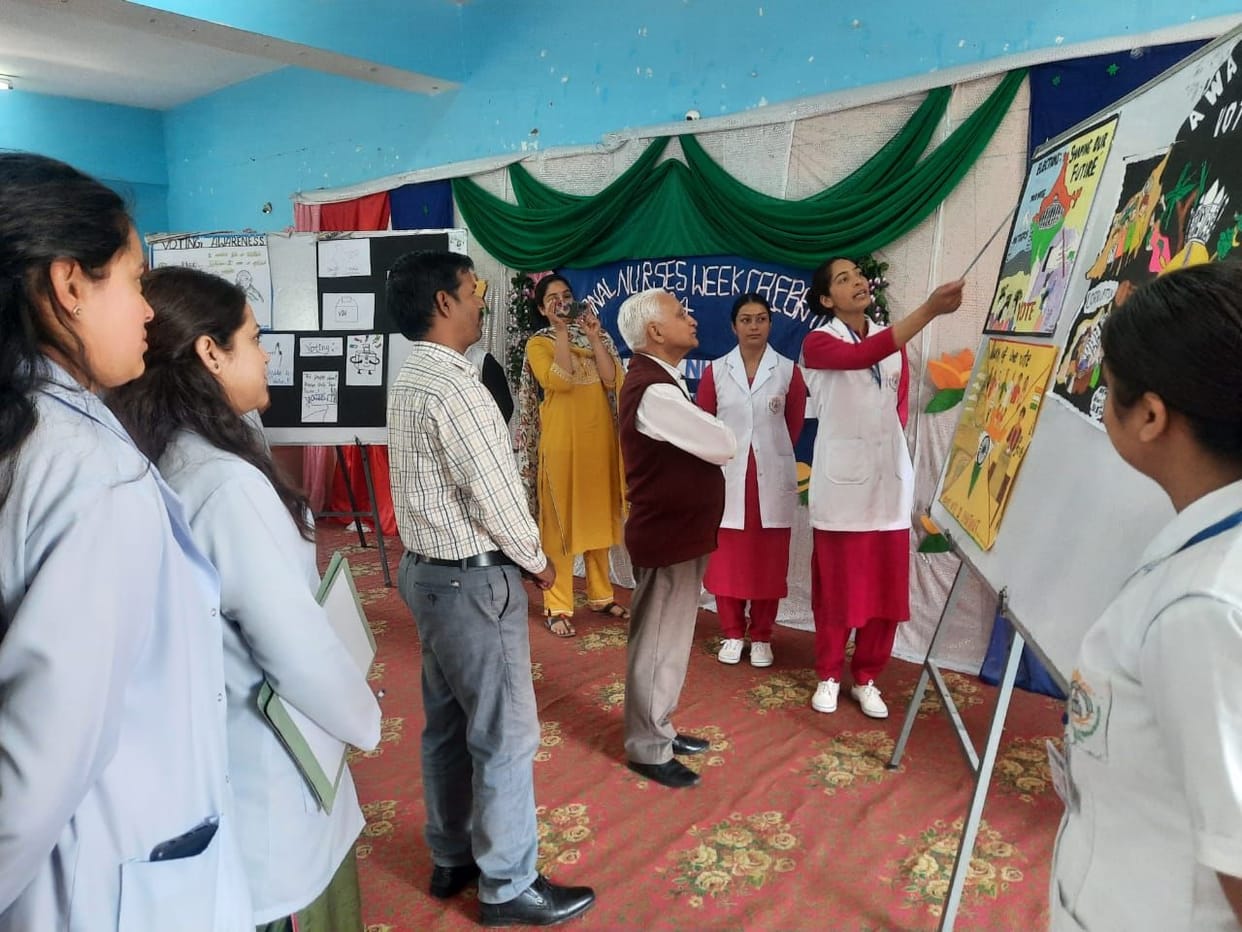 Girls of Chamunda Nursing College are making rangoli