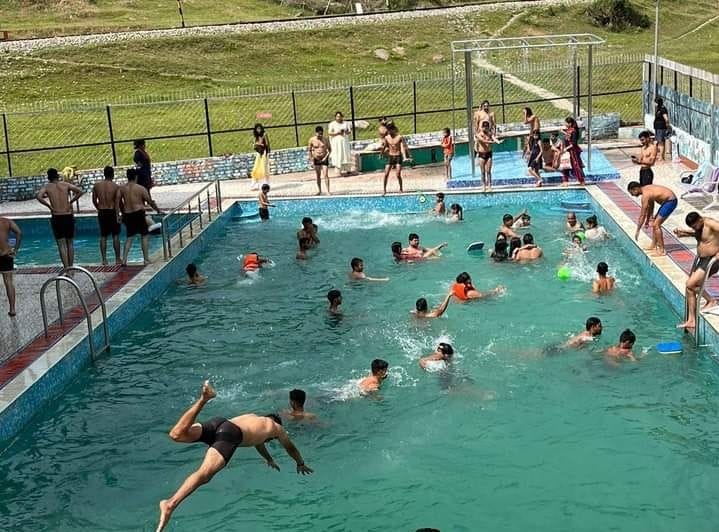 Crowd of youth increased in swimming pool and ravines