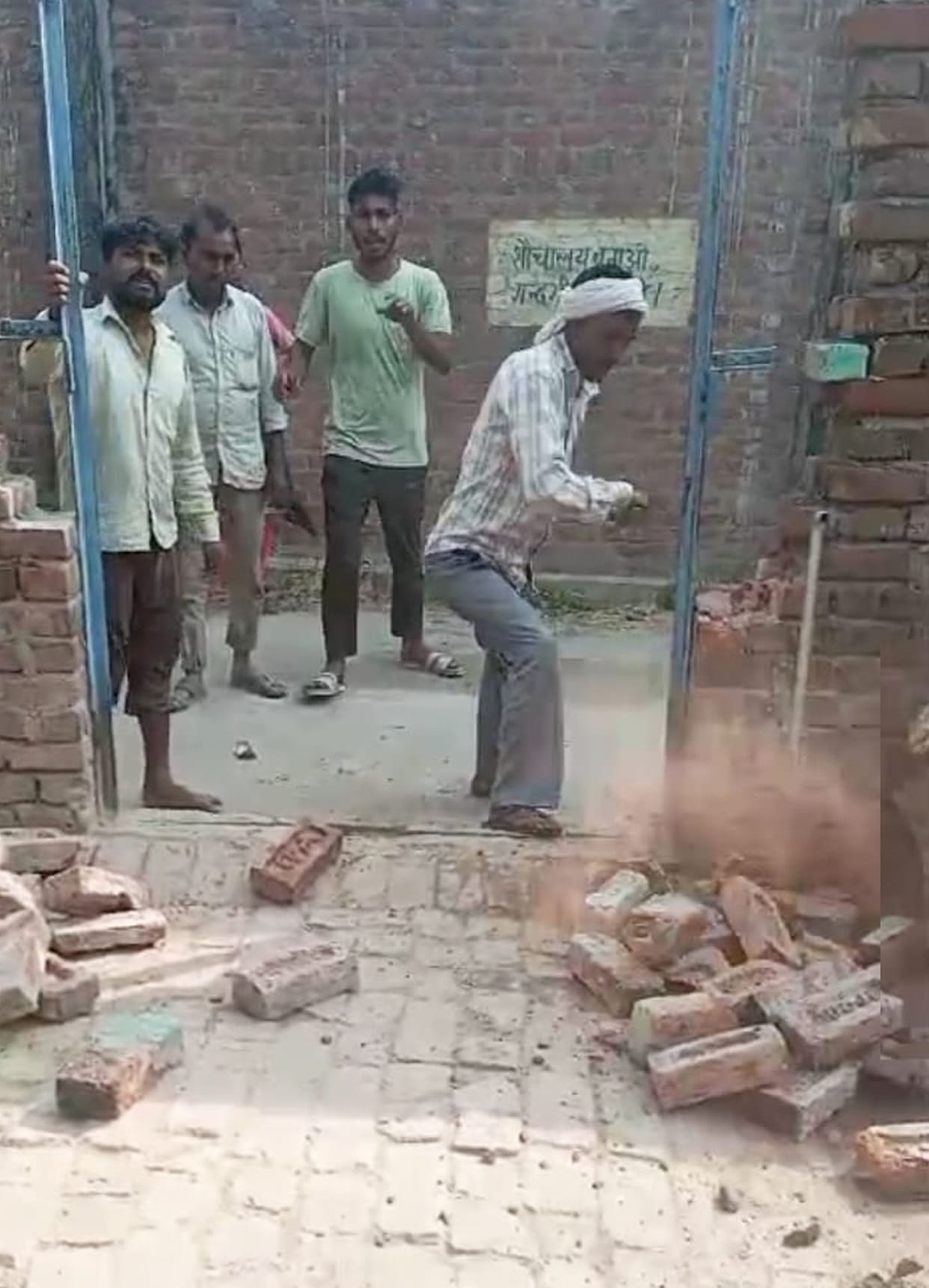 In Daulatpur, the bullies broke the wall with a hammer, uprooted the door and took it away.