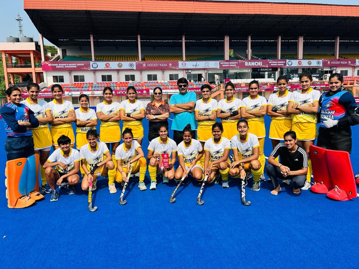 Haryana women's hockey team with coach Anil Dabas and manager Lakhwinder Kaur after winning.