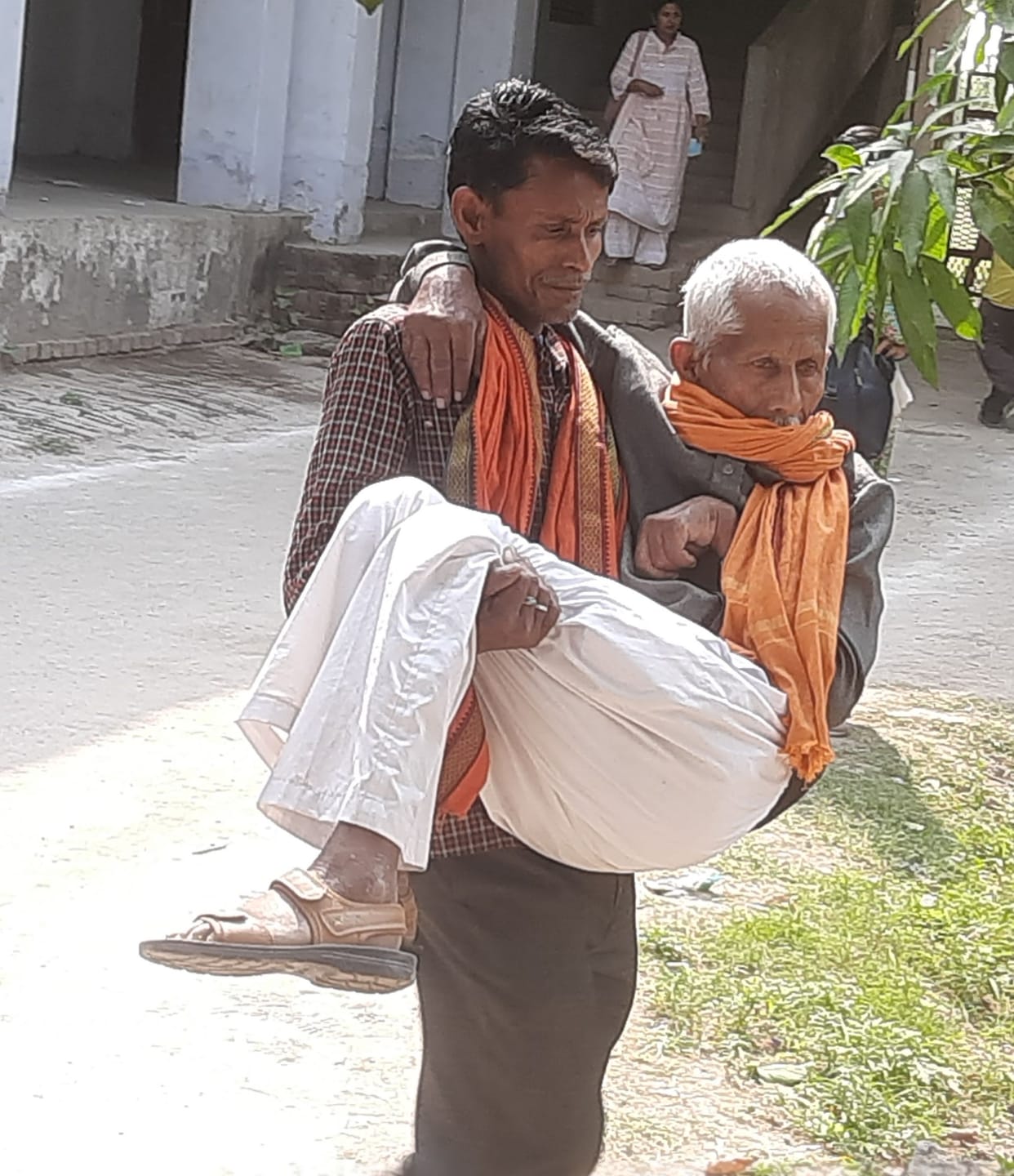 Ram Kishore arrived for election training with his son in his lap.