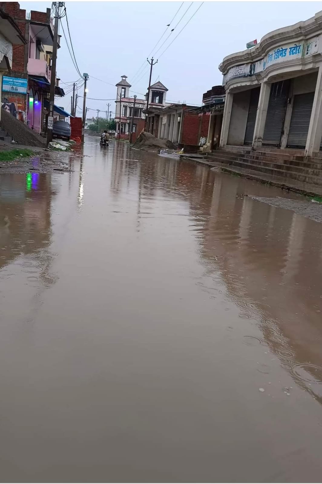 Potholes on the road for two years, pond formed after rain