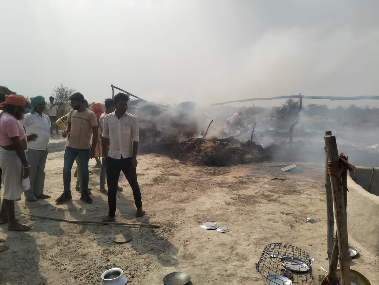 Huts burnt by fire at Dhai Ghat on the banks of Ganga