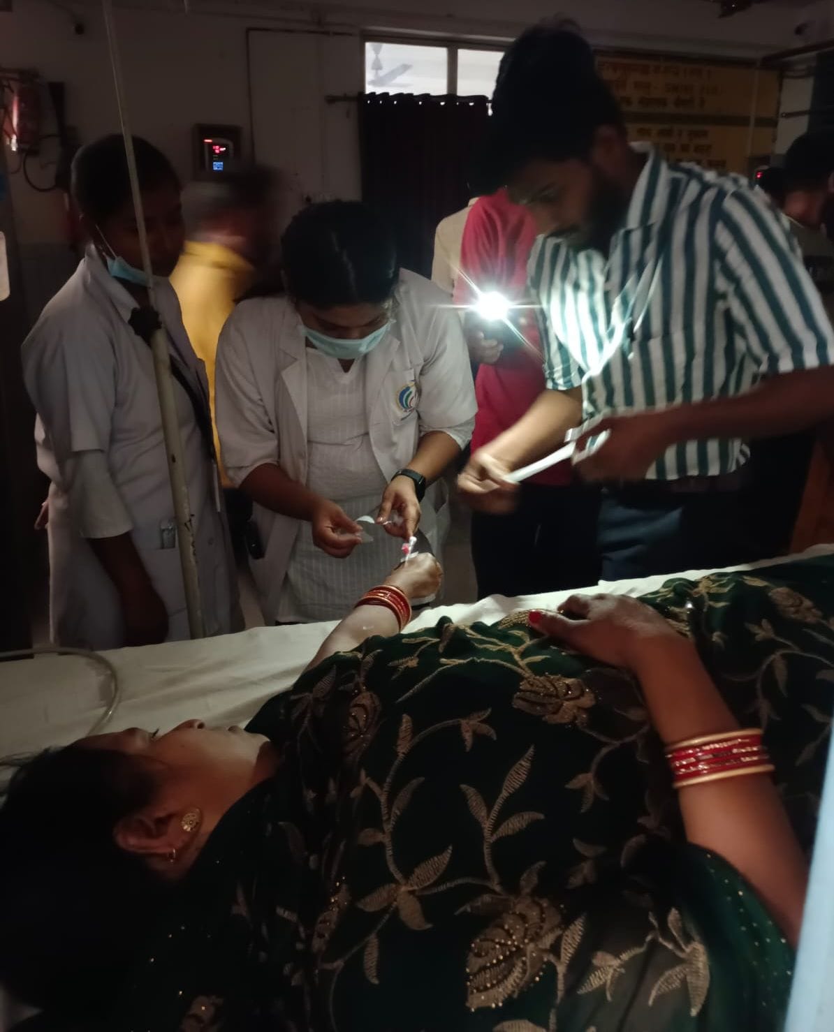 Power failure in emergency...treatment with the help of mobile torch