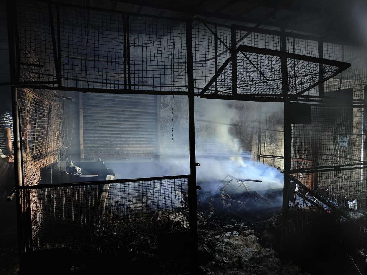 Damage caused by fire in three shops