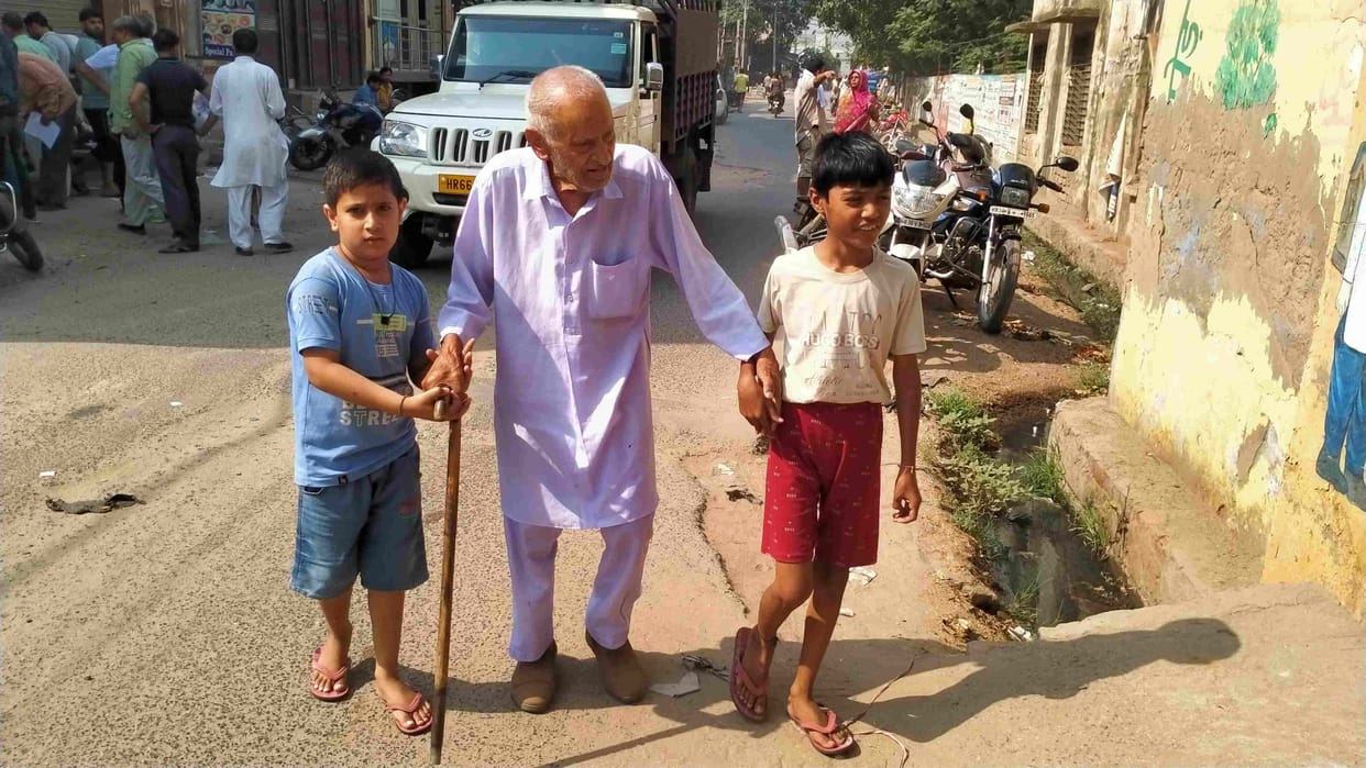 Children fulfilled their duty, grandfather's hand grabbed grandson and granddaughter