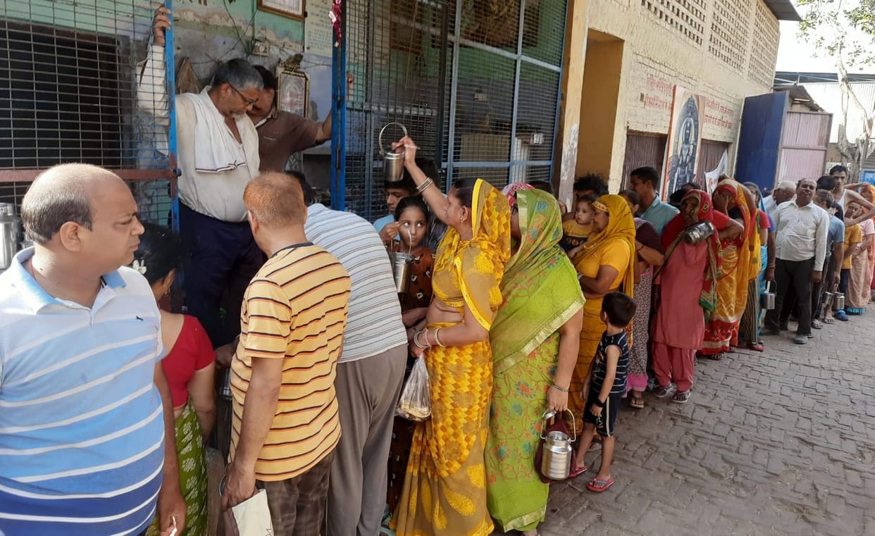 Facing the brunt of the heat, there is a queue outside the cowshed even for free lassi.