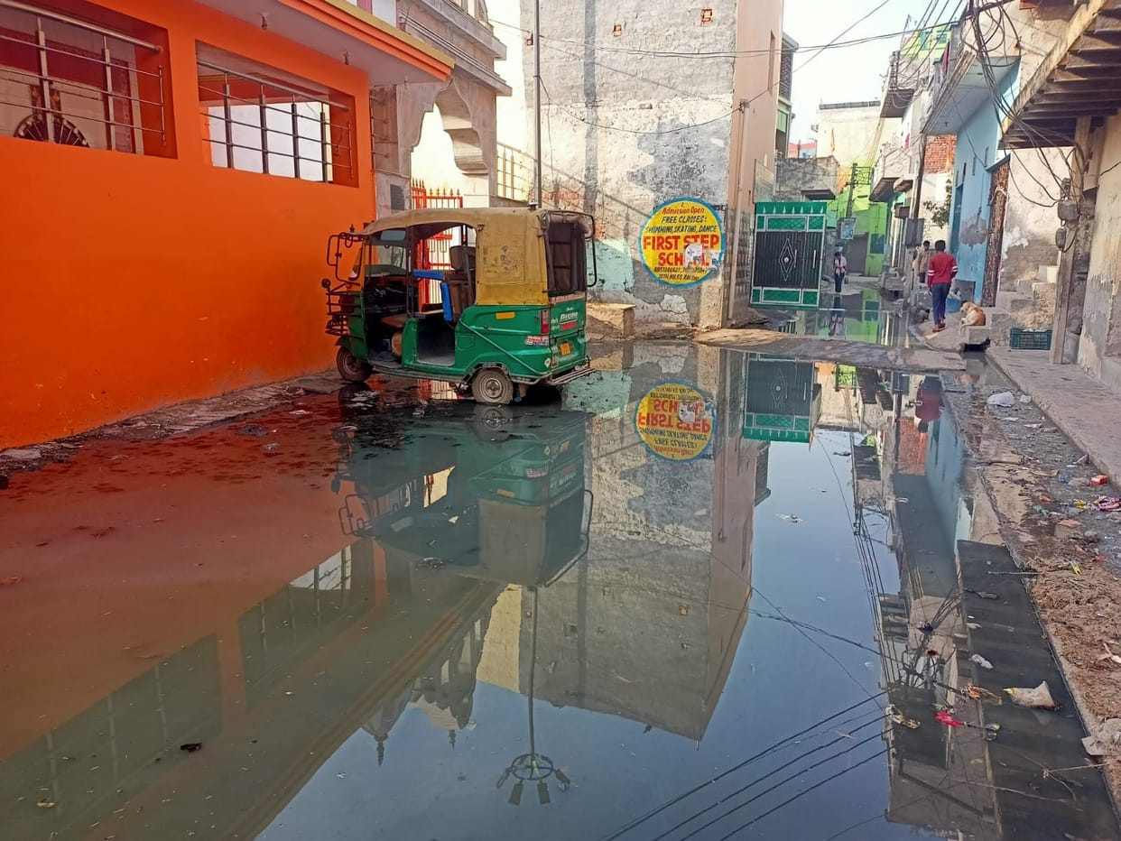 Contaminated water flowing in the street, difficulty in going to temple