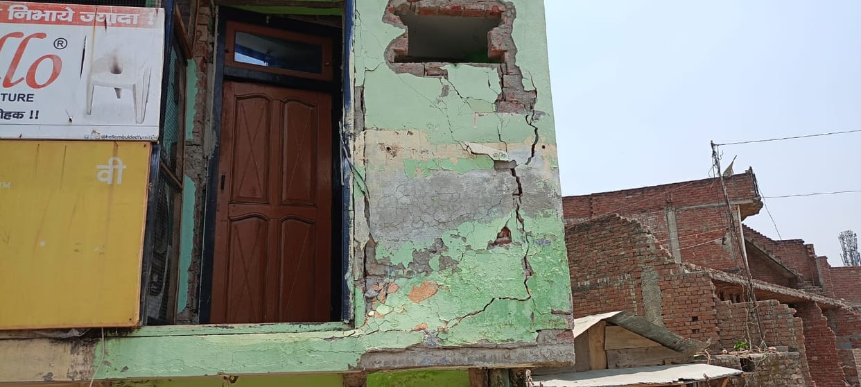House damaged after being hit by bus
