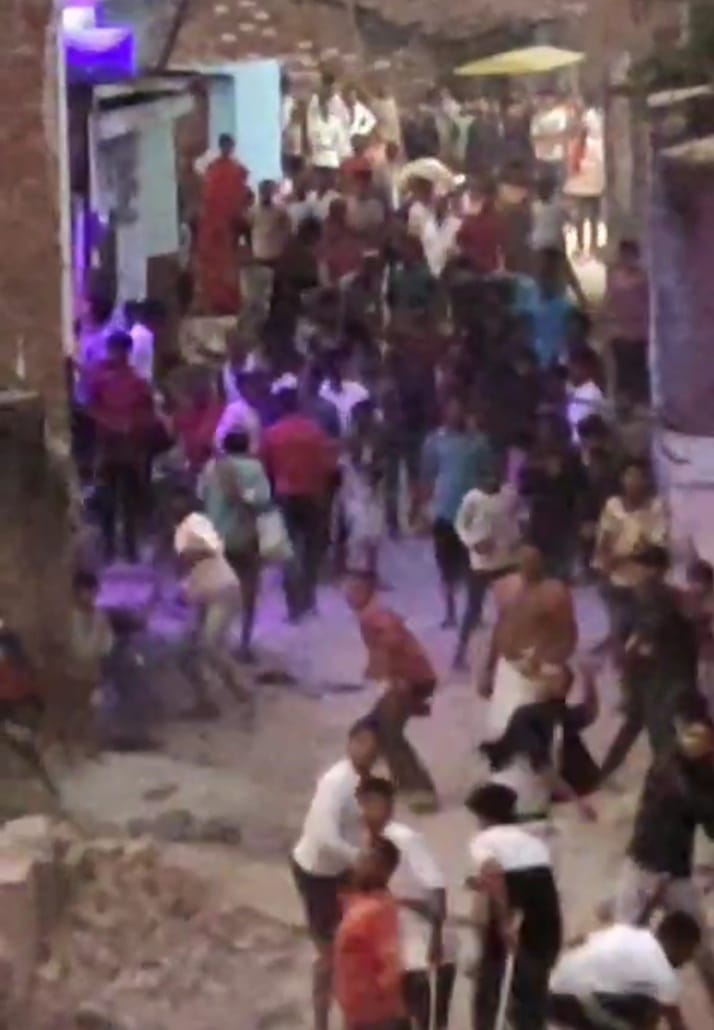 Fight between two parties over bike parked on the road, heavy stone pelting