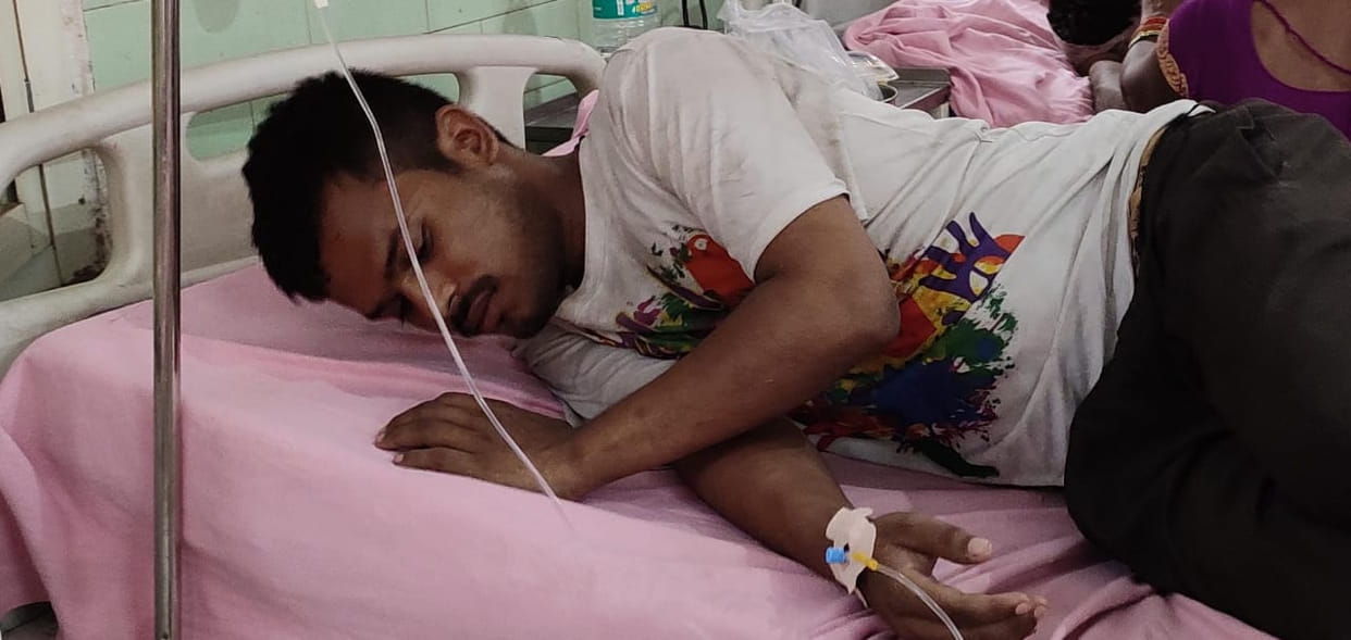 Youth suffering from heat faints on the road