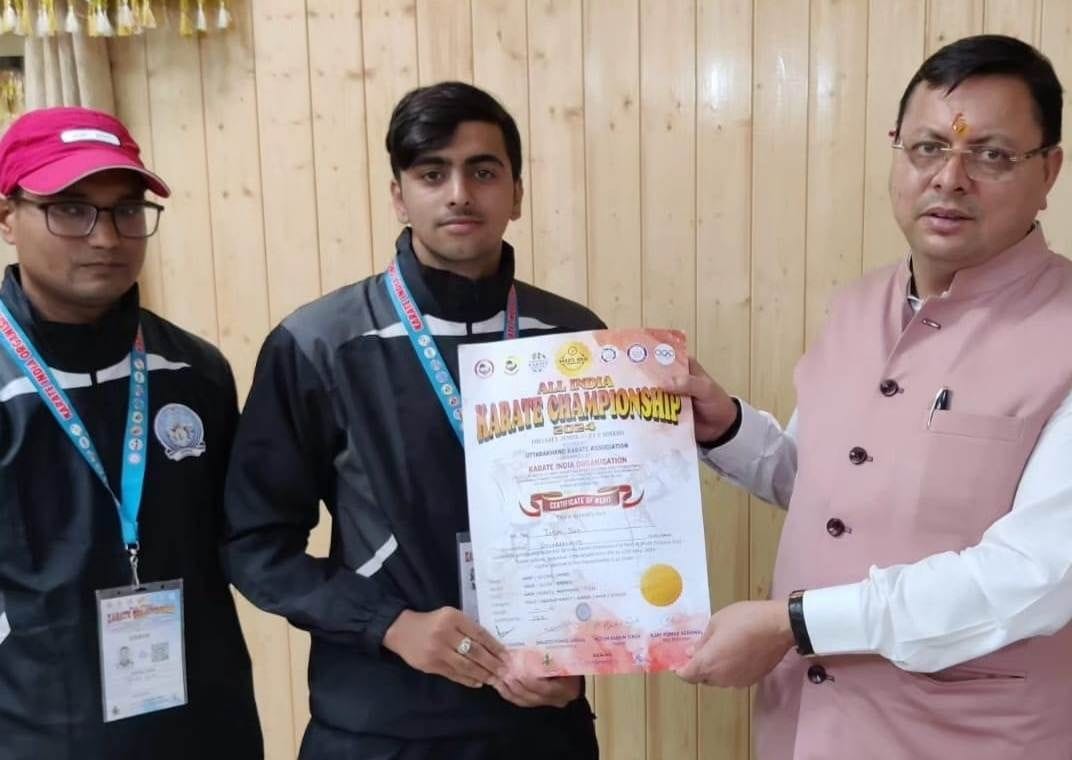 CM Dhami honored karate player Jatin and coach Deepak