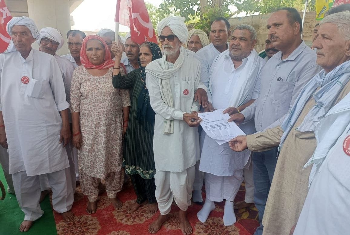 Villagers staged a protest at the railway gate due to non-completion of overbridge work.