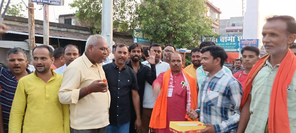 Burst crackers and distribute sweets on BJP candidate's victory