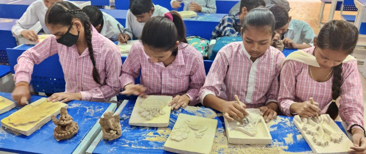 Children are learning the tricks of idol craft during Tabor festival