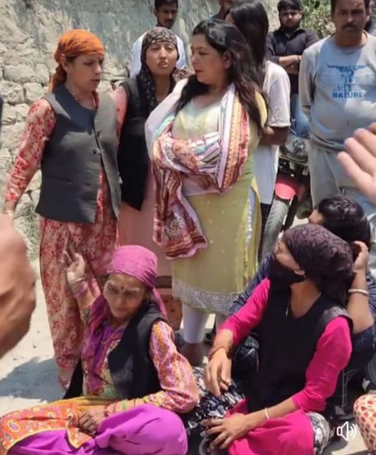 Troubled by the dust rising from the highway, women staged a protest, causing a jam