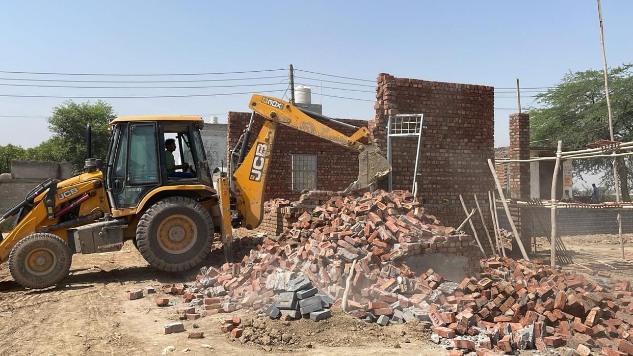 Bulldozer fired on house in illegal colony, road broken
