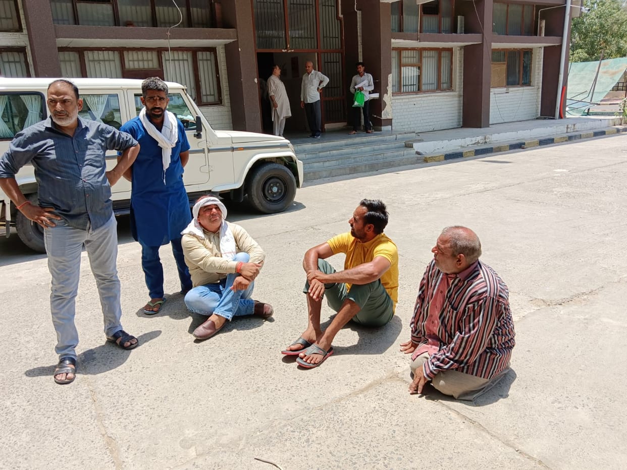 Samadhan camp was going on inside, disabled person sitting on the hot ground outside asked for justice