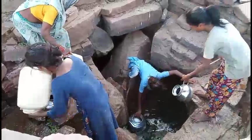 Villagers of Devtara village are quenching their thirst with water from Jhiriya of the forest